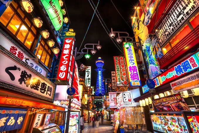 Tsutenkaku Tower in Shinsekai (new world) district at night, Osaka, Japan